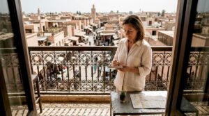 Woman planning from Marrakech riad balcony