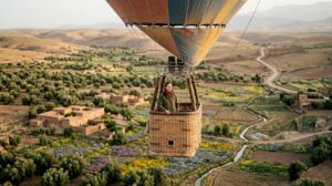 Hot air balloon over Moroccan plain at sunrise