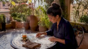 Traveler planning Morocco trip with map